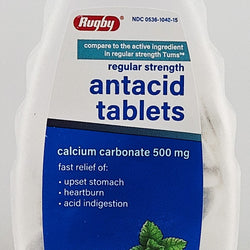 Bottle of Rugby antacid tablets with blue and white label on a white background